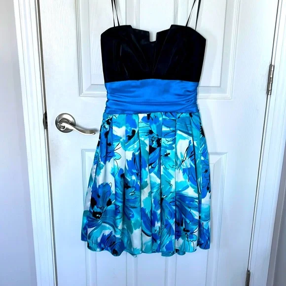 Strapless Dress with black top, blue ribbon around waist, flowy flowery  bottom